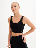 a woman in a black sports bra top