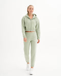 a woman in a light green sweat suit