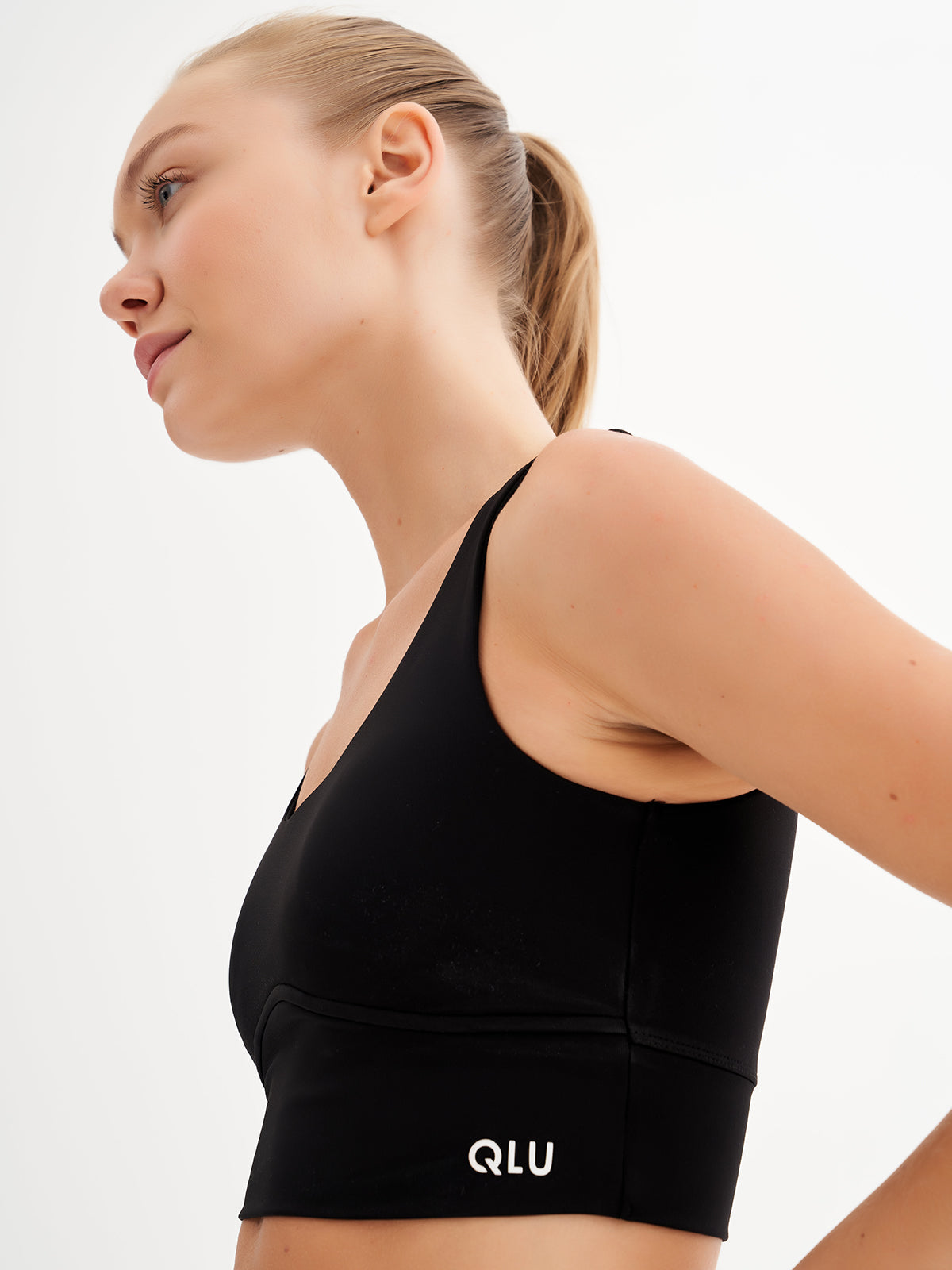 a woman wearing a black sports bra top