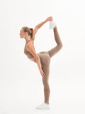 a woman is doing a yoga pose on a white background