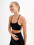 a woman in a black sports bra top