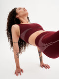 a woman is doing a yoga pose on a white background