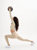 a woman is doing a yoga pose with a ball