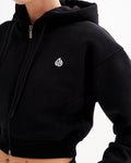 a close up of a person wearing a black hoodie