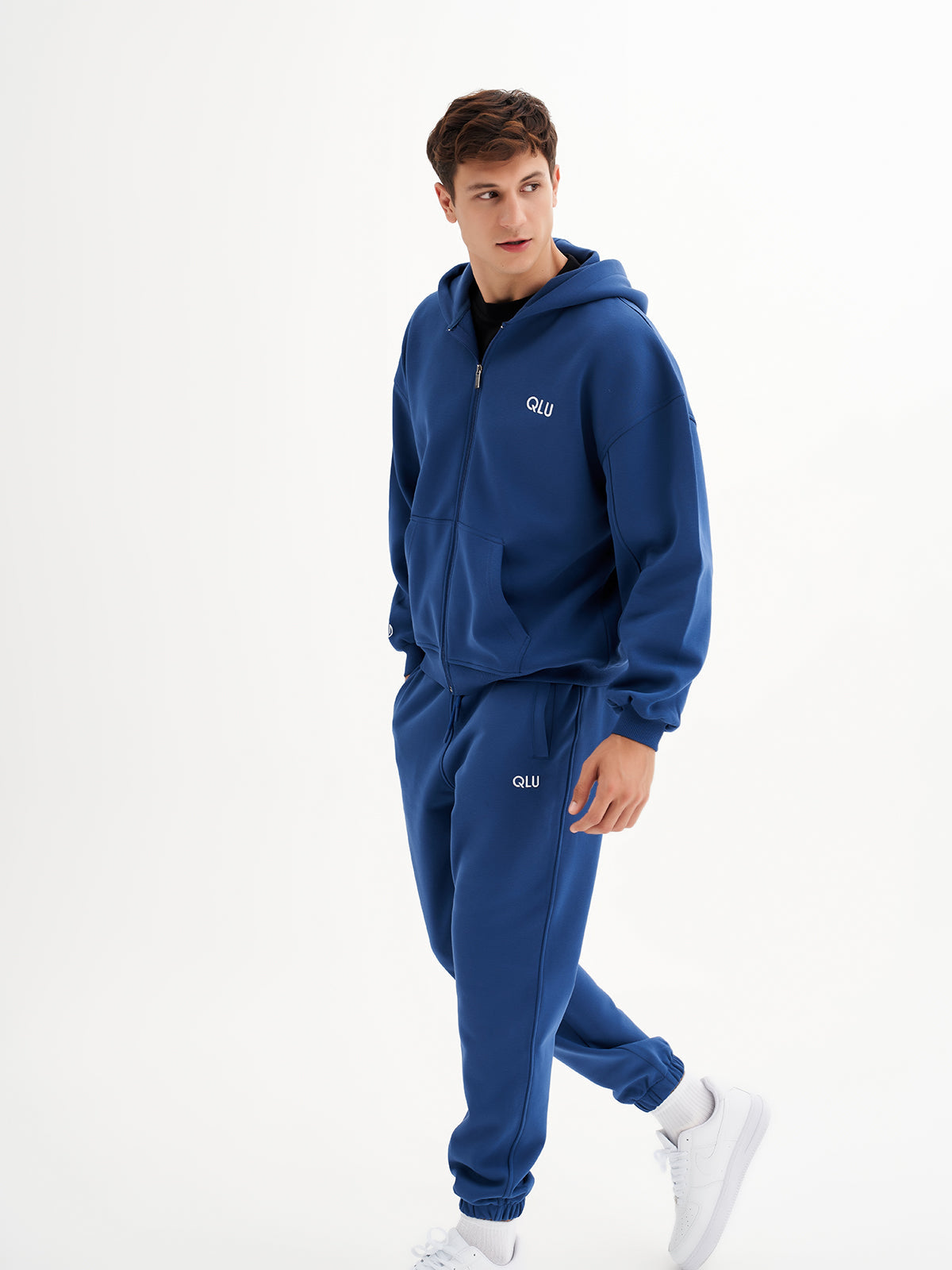 a young man in a blue sweat suit